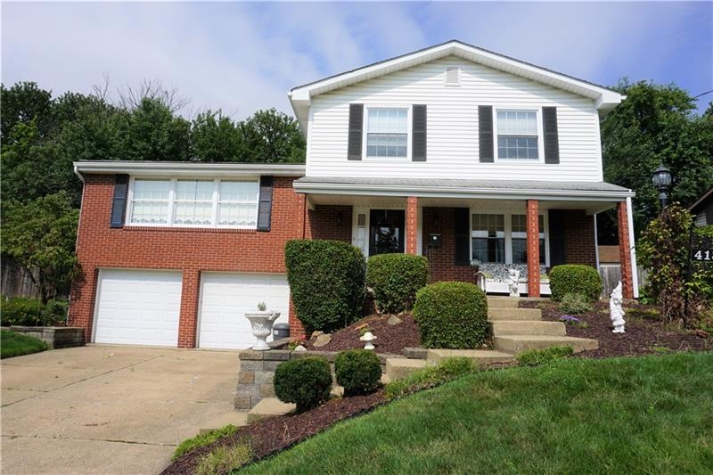Stunning curb appeal.  Covered front porch and bea
