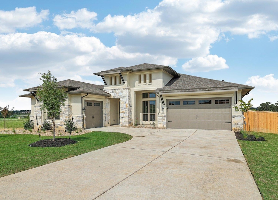 Prairie-style house featuring fence, an attached 