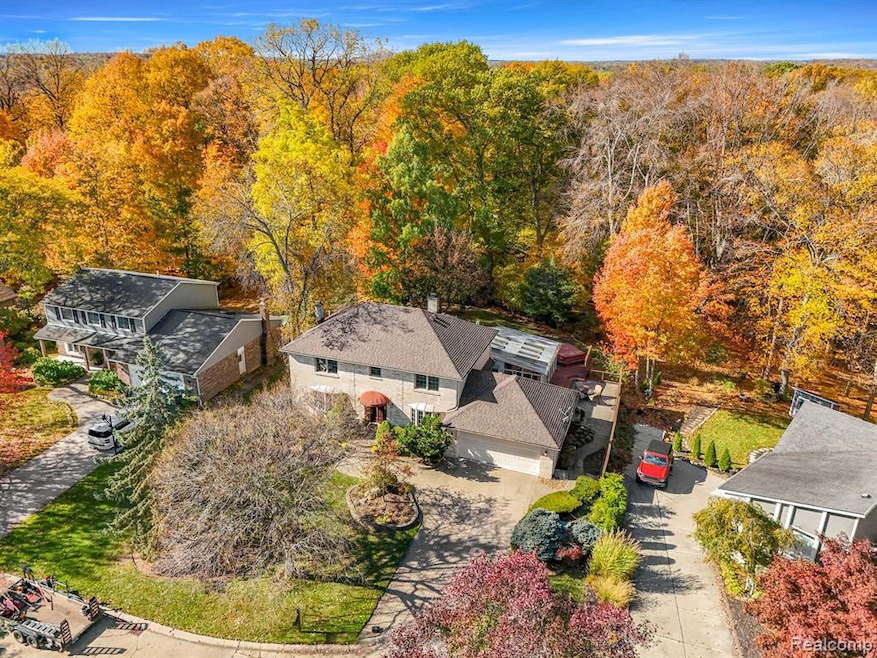 View from above of property with a forest