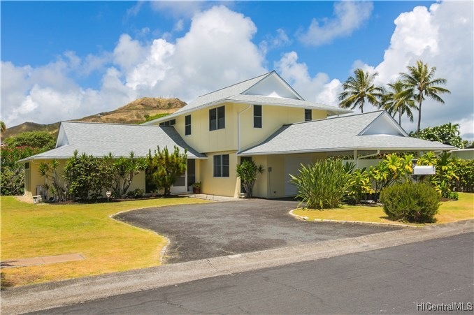 Street view of the home.  Two car-carport, and gue