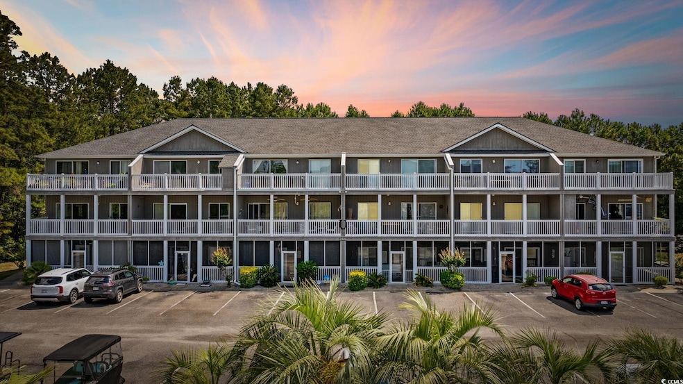 Property at dusk featuring uncovered parking