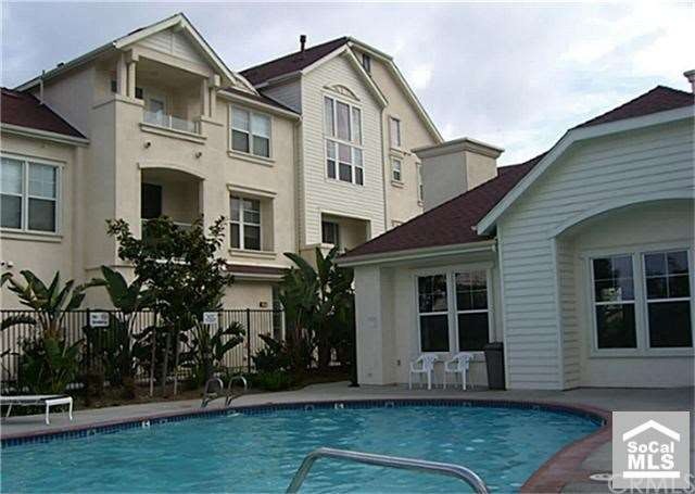 Community pool and clubhouse, unit shown behind
