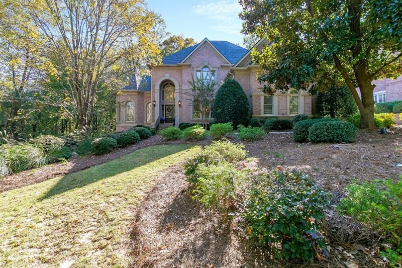Four sides brick home on almost once acre backs up