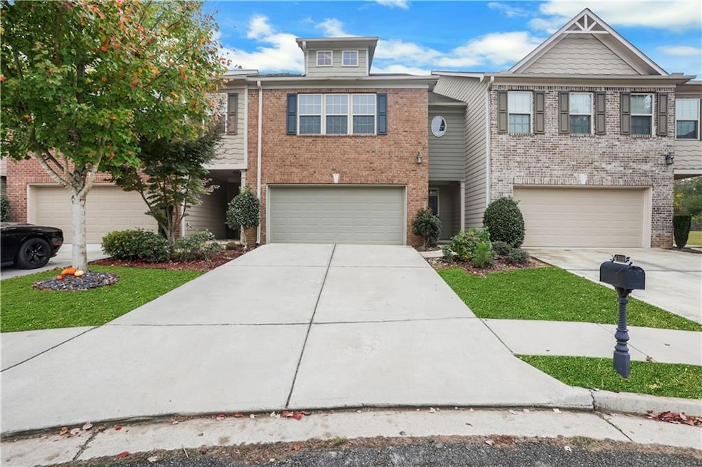 View of property with a garage