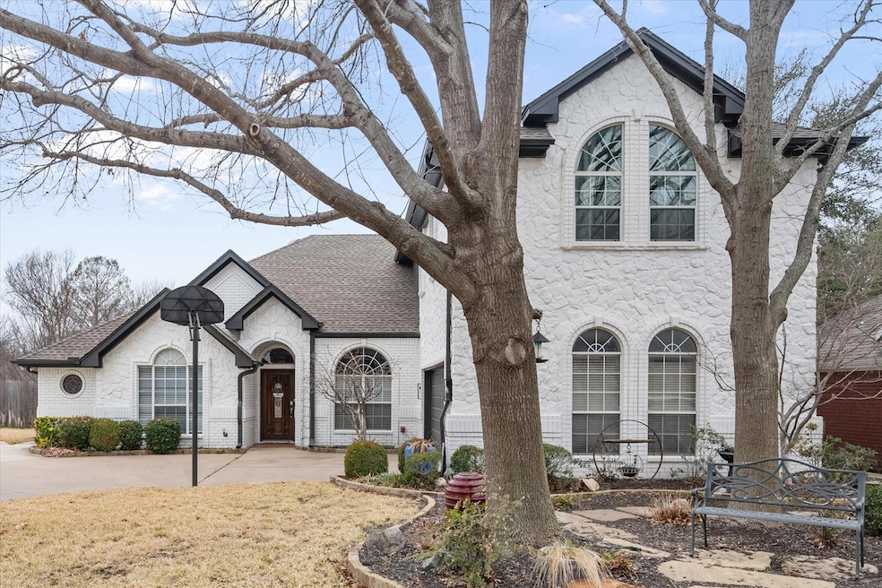 French provincial home with a patio
