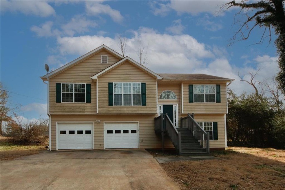 Raised ranch featuring a garage