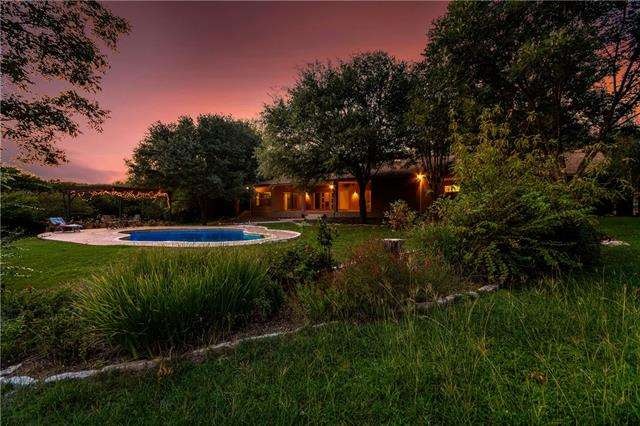 View from the back yard of the grounds, lush lands
