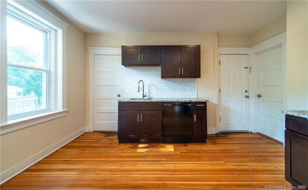 Beautiful Kitchen with granite and subway tile bac