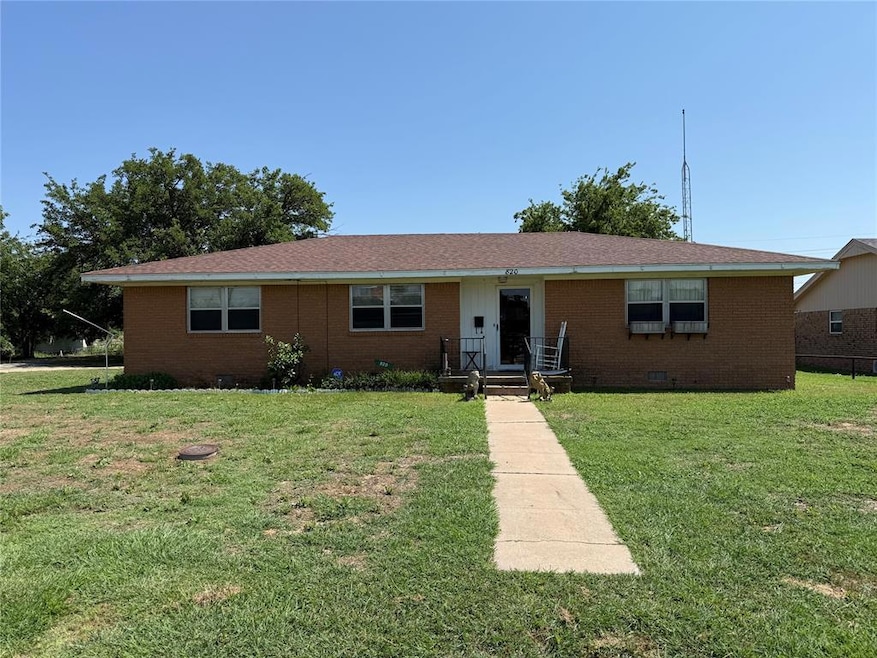 Ranch-style house with brick siding, a front yard, and crawl space