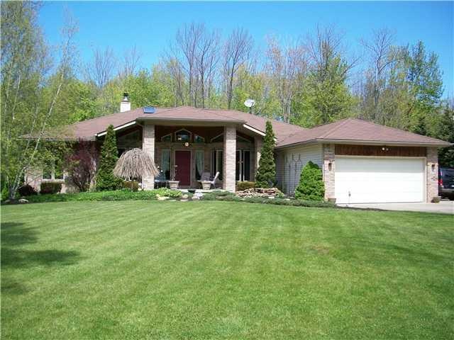 Exterior Front gorgeous treed acre lot with no rea