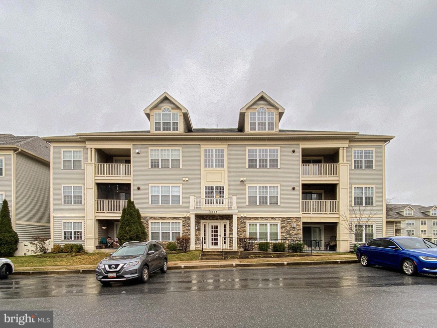 8903 Stone Creek Place unit 304, Pikesville, MD 21208 - photo 1