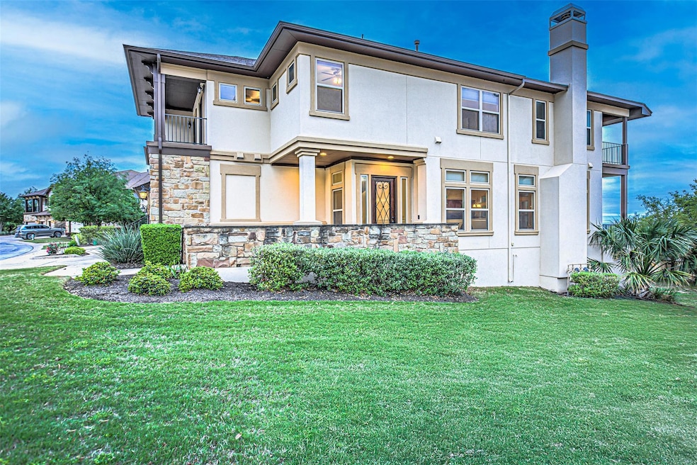 Back of house featuring a yard, stucco siding, st