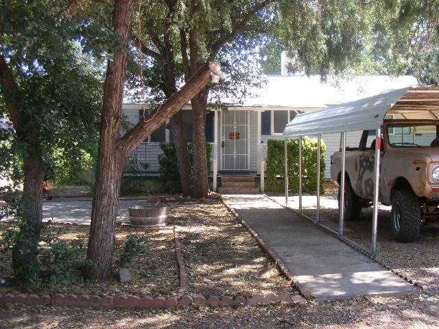 Front of House with Carport