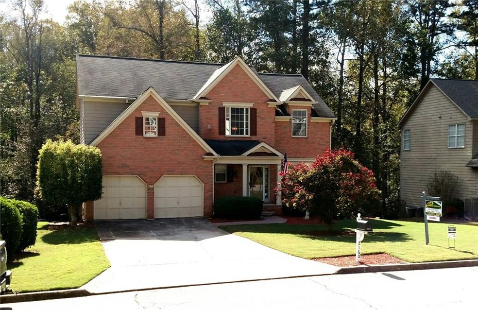 Very level front yard with this beautiful mature J
