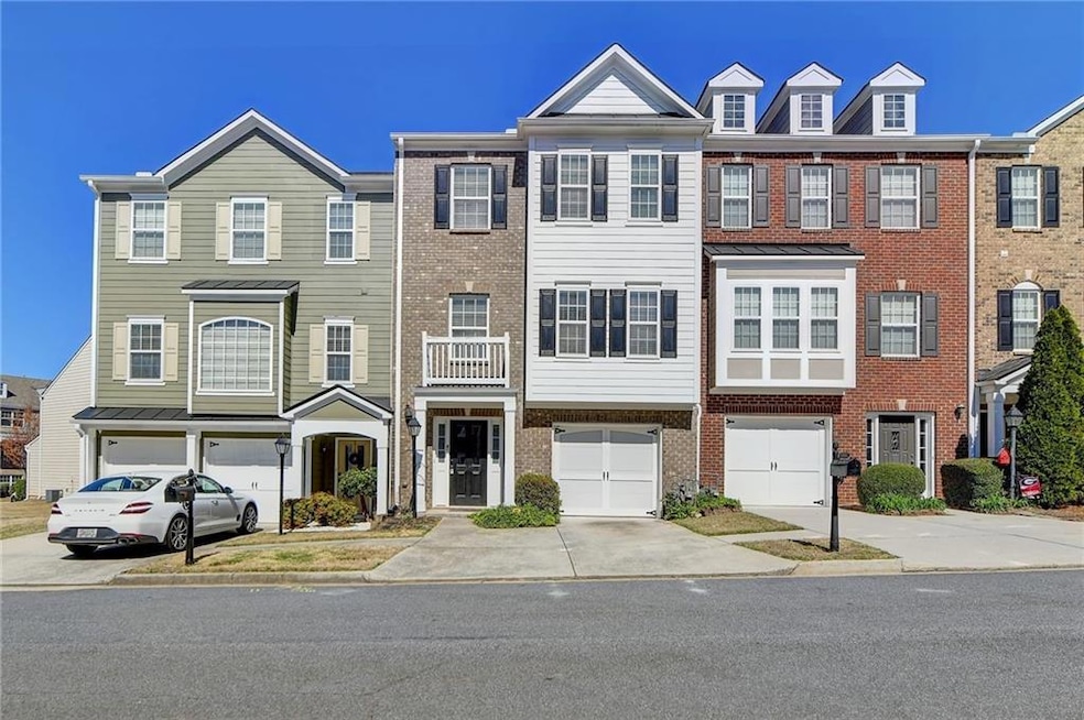 View of property featuring a garage