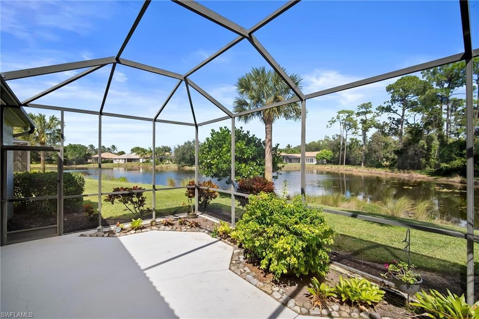 View of patio / terrace featuring a lanai, a sunroom, and a water view