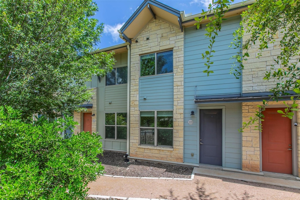 View of front facade featuring stone siding