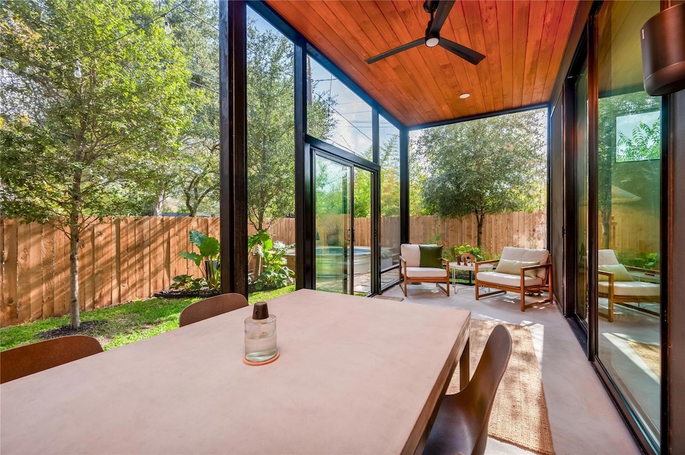 Sunroom / solarium with floor to ceiling windows,