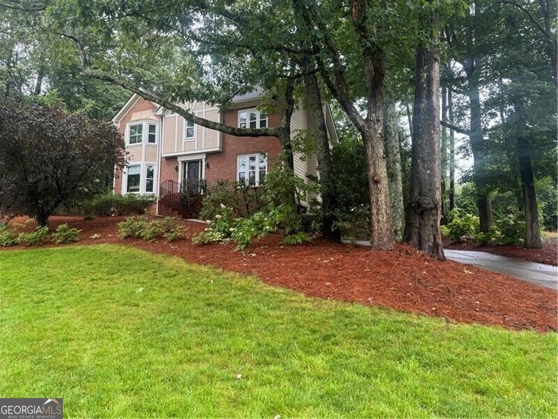 View of front of home featuring a front lawn