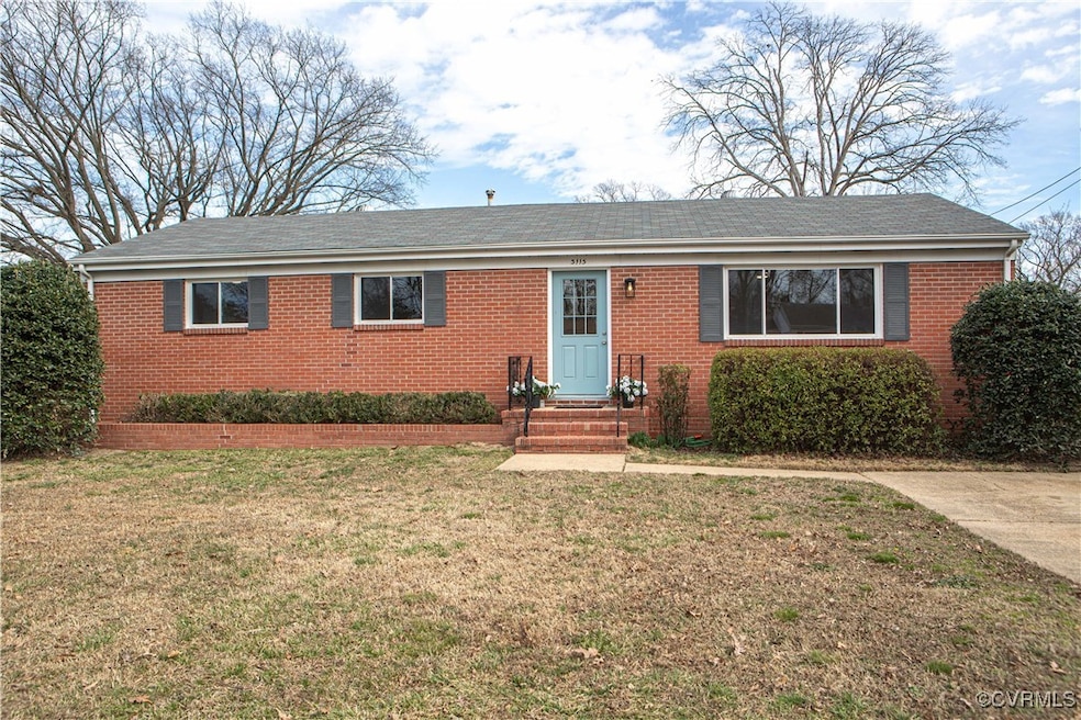 Ranch-style house featuring a front lawn and brick