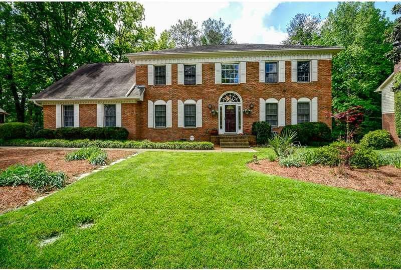 Exterior Front. Brick beauty with luscious grass b