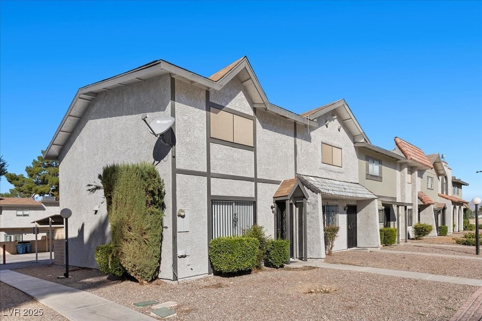 View of front of home featuring stucco siding and a residential view