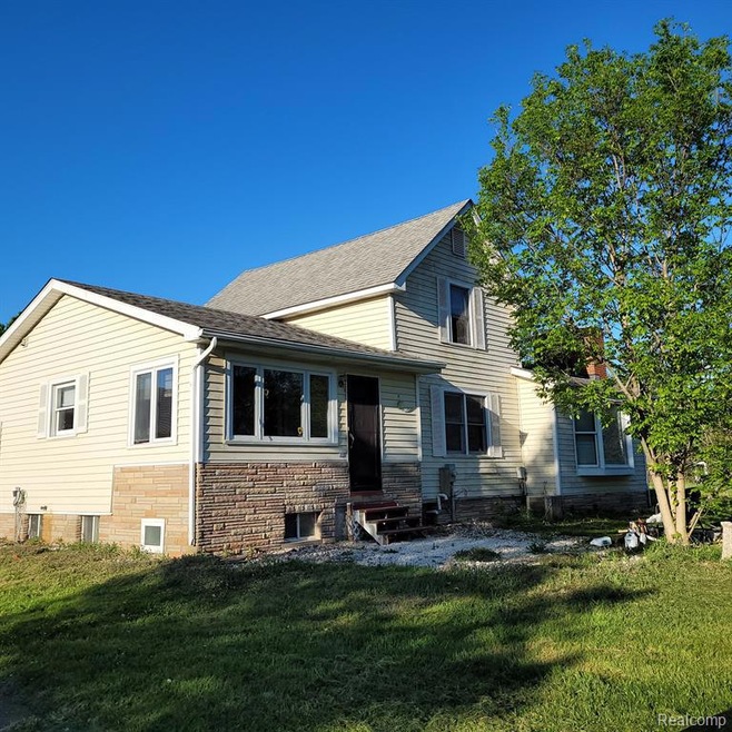 FRONT AND SIDE OF HOUSE
