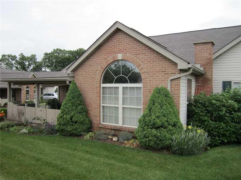 Exterior Front. Striking brick exterior and pallad