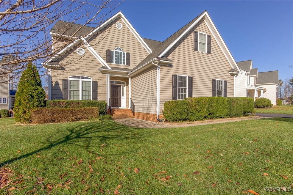 View of property with a front yard