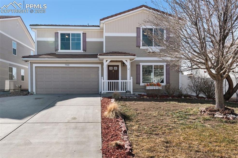 Traditional-style house with concrete driveway and