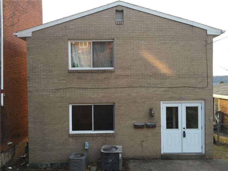 Brick and vinyl two unit duplex close to Rote 130 