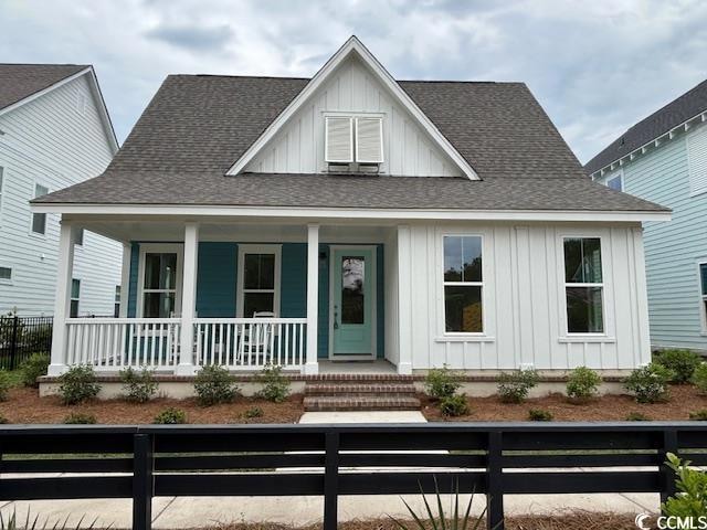 View of front of home with board and batten siding