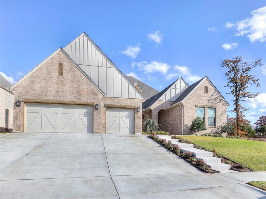 View of front facade with a garage and a front yar