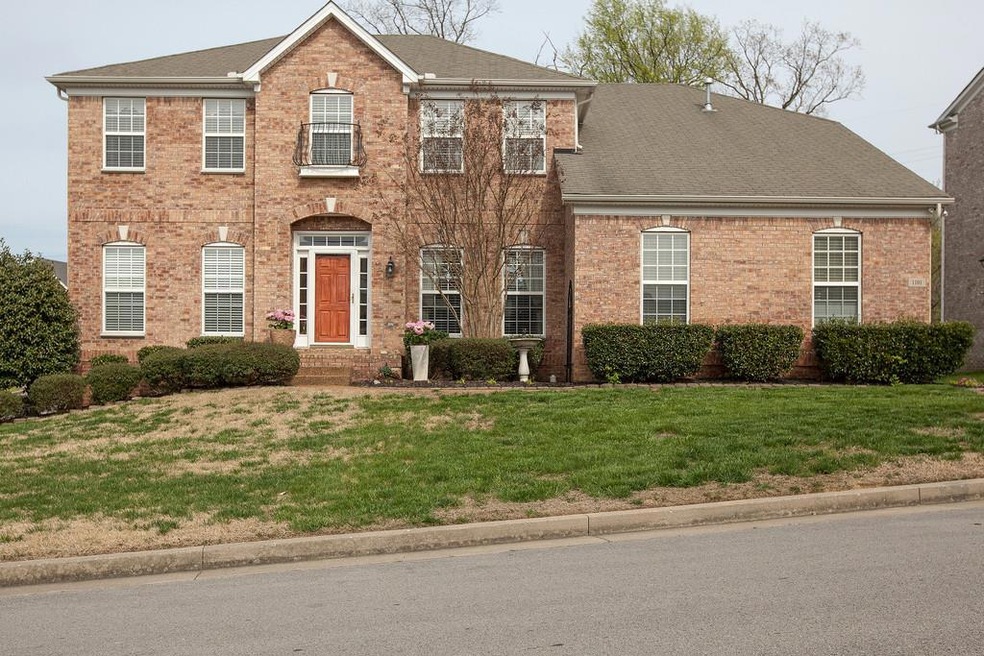 Lovely two story brick home in Brentwood TN. Large corner lot backs up to community common area.