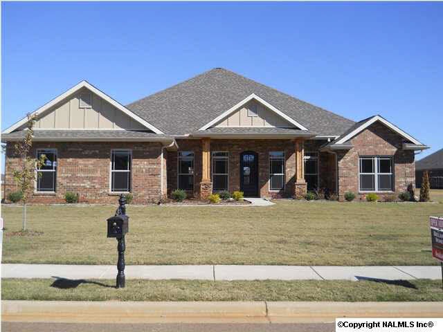 Full Brick with Hardi Board trim, Craftsman stone & cedar columns