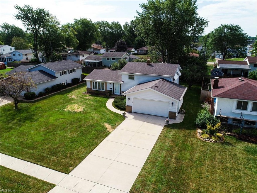 Welcome to 2101 W 39th St. with a newer concrete d