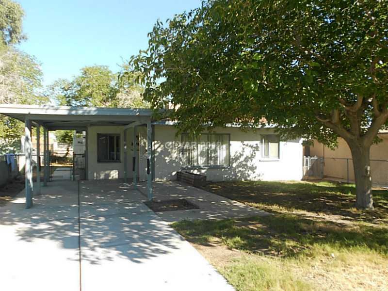 Property Photo. Carport for shaded parking. Gate t