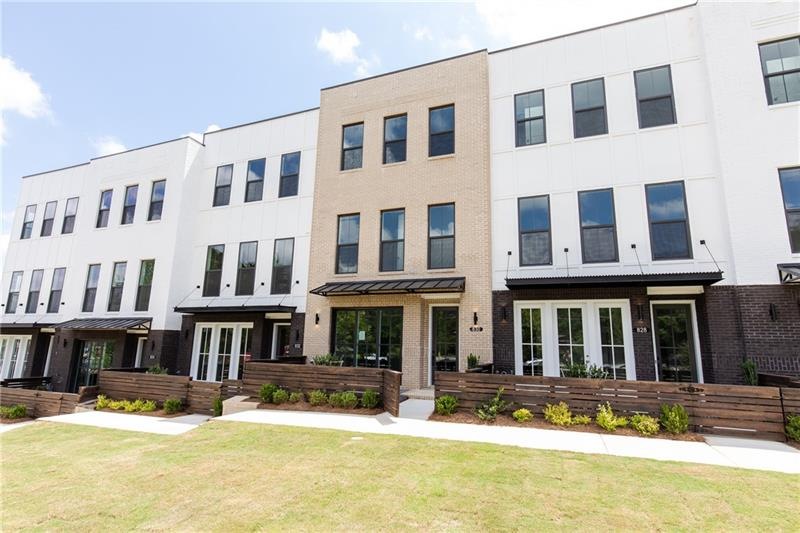 3 STORY MODERN UPSCALE BRICK TOWNHOME with Fenced 