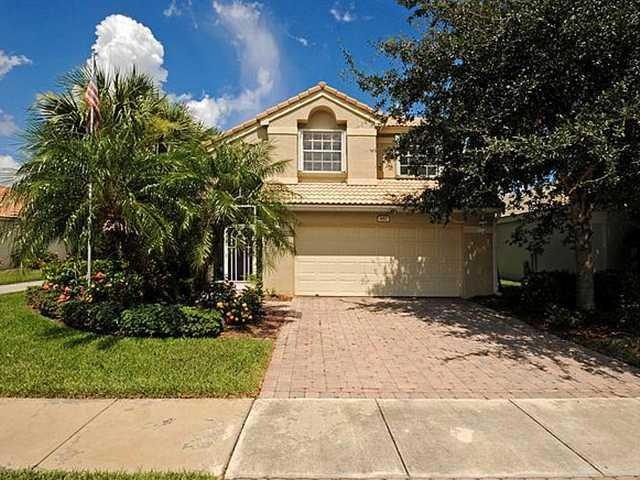 Exterior Front. Double door entrance to the large Living and dining rooms.  Brand new Hardwood flooring and paint. The breeze is wonderful with the doors open front the front screened area... Great in the wintertime for frest air and sun.