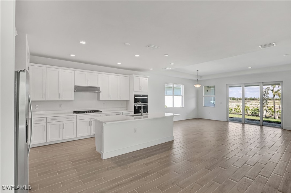 Open-concept floor plan layout with kitchen, great