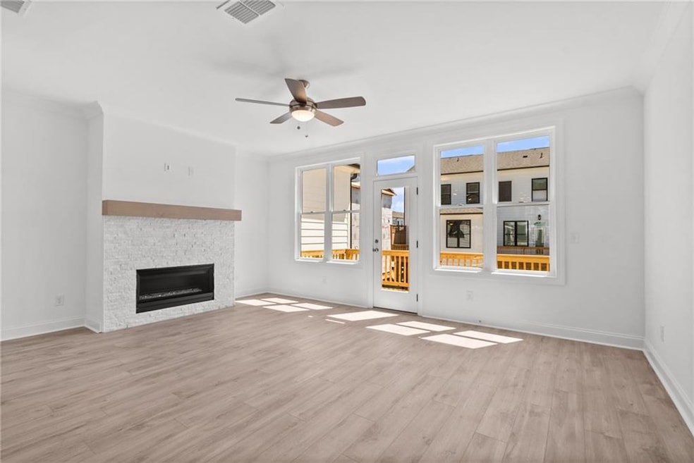 The cozy fireplace adds warmth and charm to the family room. Photo not actual home, but previously built Freemont plan.