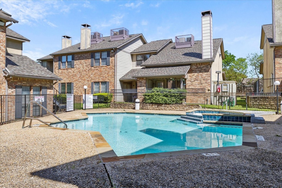 View of pool featuring a community hot tub