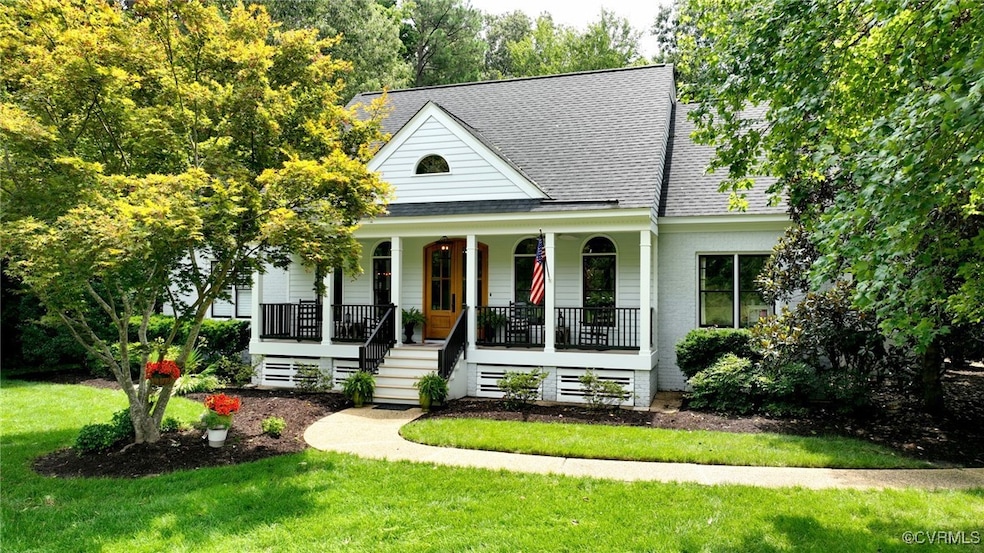 View of front of home with a front lawn and covere