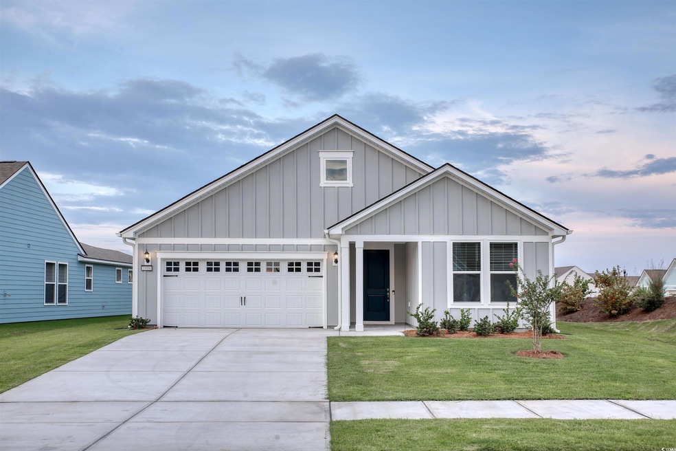View of front of property featuring a garage and a