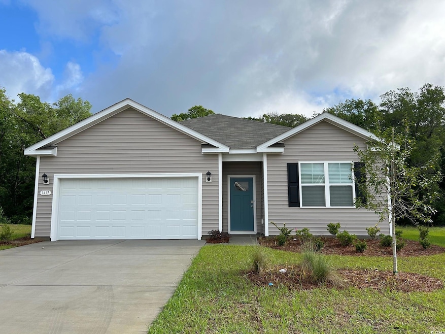 Ranch-style house with driveway, an attached garage, and roof with shingles