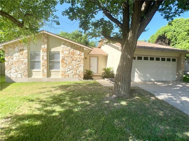Inviting one story home with large shade trees!