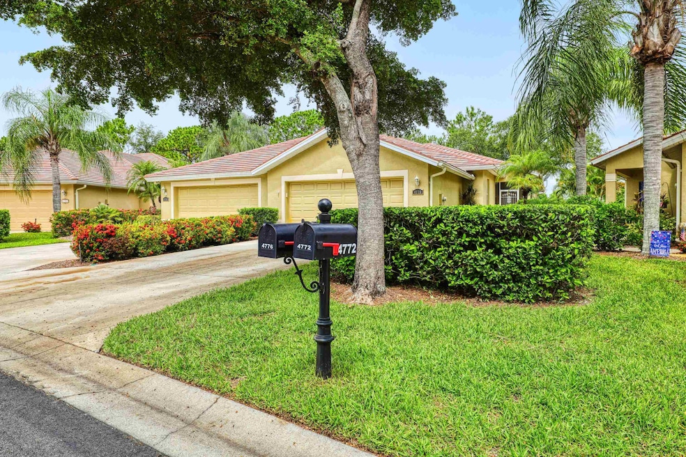 Ranch-style home featuring stucco siding, a front lawn, driveway, and an attached garage