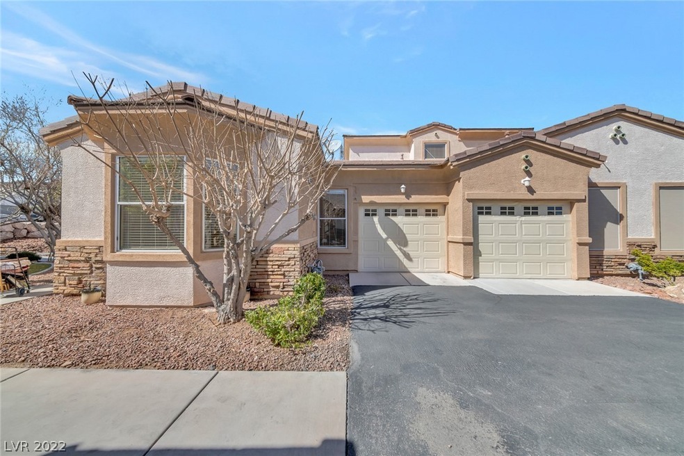 
front Entry with 2 Car Garage.