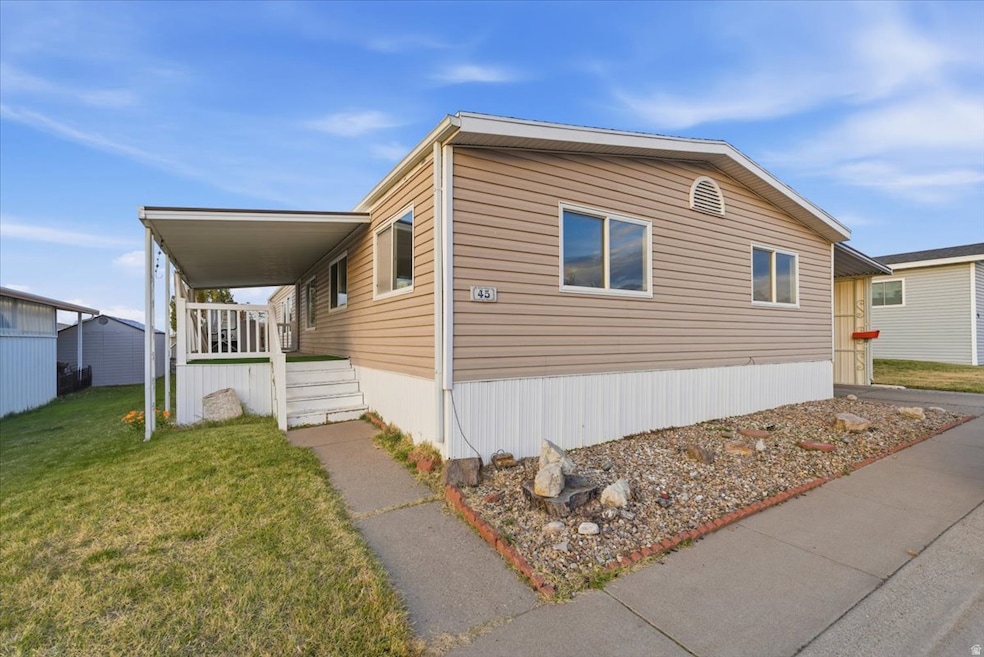 View of property exterior with a lawn