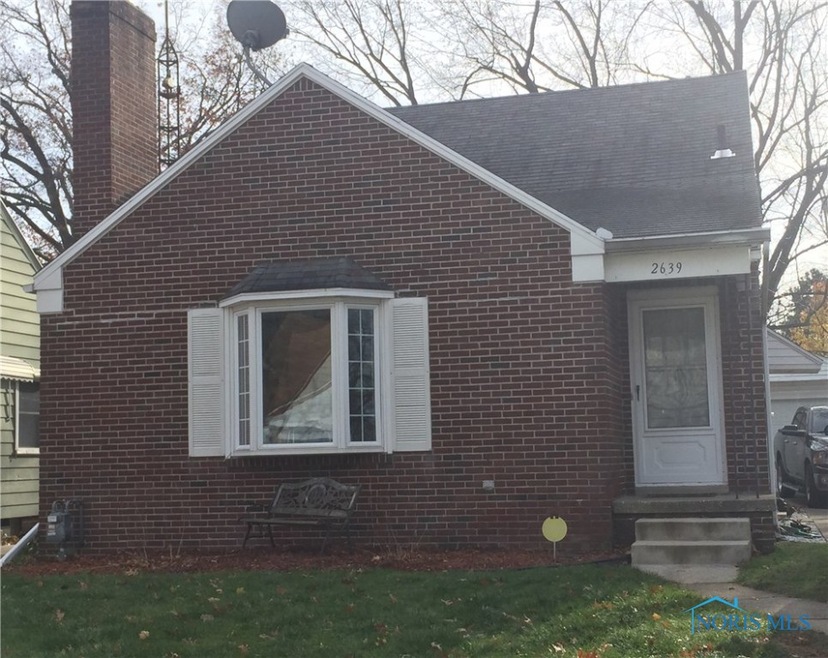 Low maintenance brick exterior with newer windows.